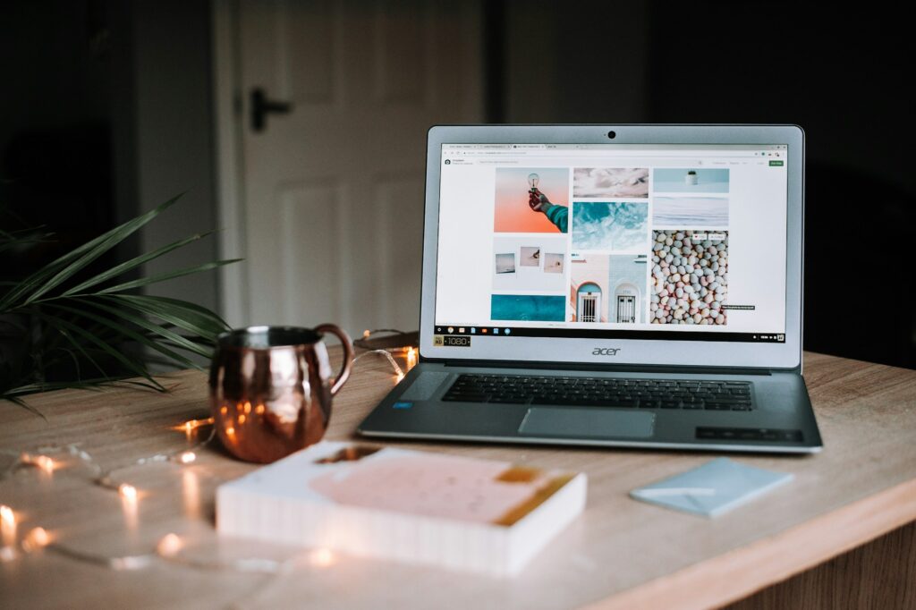 web design school might not be the answer. Built a website portfolio instead. A picture of a lpatop with images on the screen that could be a portfolio.